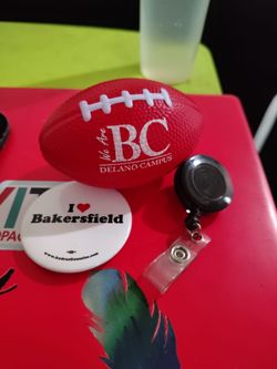 Stress football, pin, and id hanger