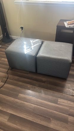 Set of two grey rolling stools