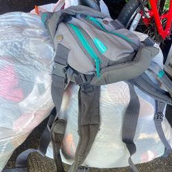 3 Bags Of Kids And Womens Clothes And Baby Carrier 
