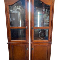 Left and Right Pier Cherry Finish Curio Cabinets - Sold Separately
