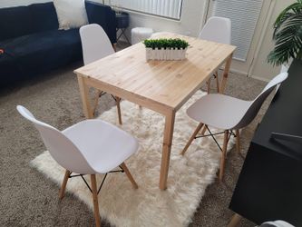 Wooden Table and 4 White Chairs.
Chairs are Brand New packed and unassembled