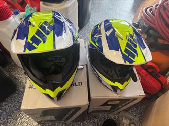 Pair of HJC motocross helmets.
