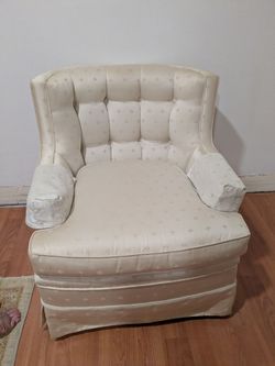 Cream color upholstered armchair