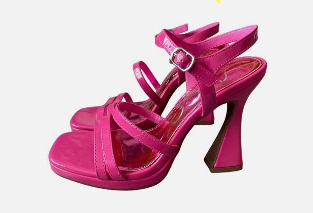 Fuchsia faux patent leather Architectural covered heel Strappy dress sandals Adjustable ankle strap with buckle closure Cushioned insole Approximate