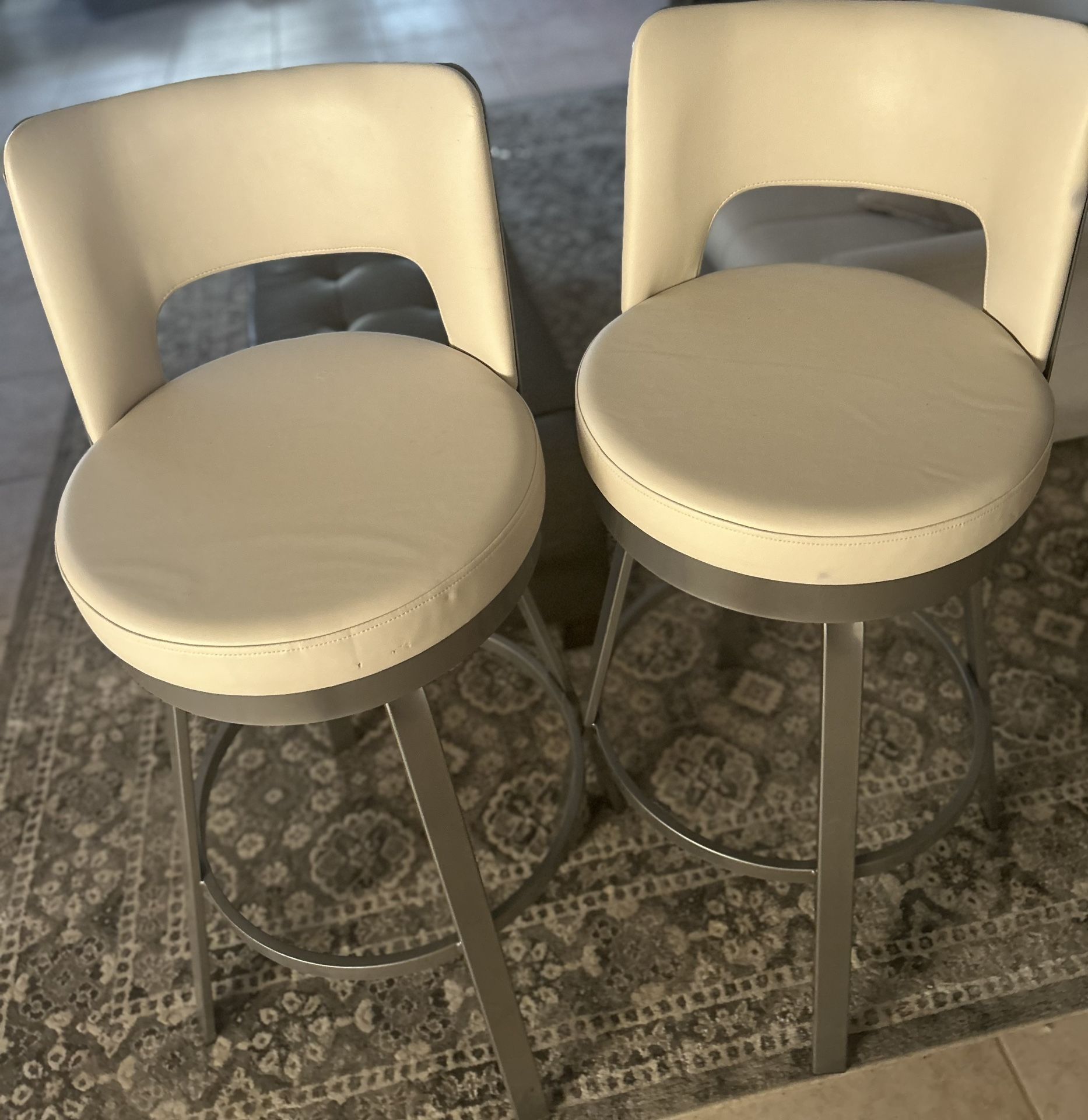 2 Cream Leather Swivel Bar Stools