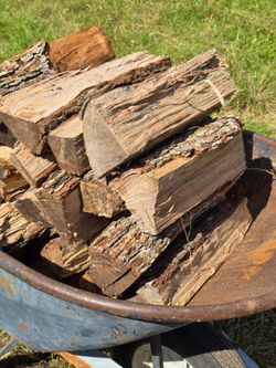 Large wheel barrow of Premium Seasoned split PECAN bbq Firewood  - $55
