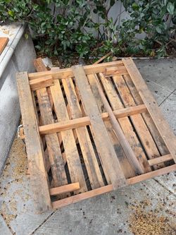 Four natural wood pallets