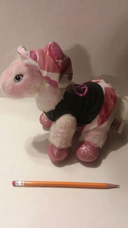 Little pink camo outfit on little stuffed horse
