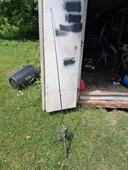 Vintage two piece fiberglass rod with a quantum ss4 zebco engineer fishing reel