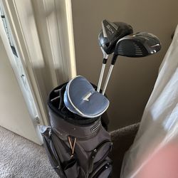 Golf bag plus broken clubs