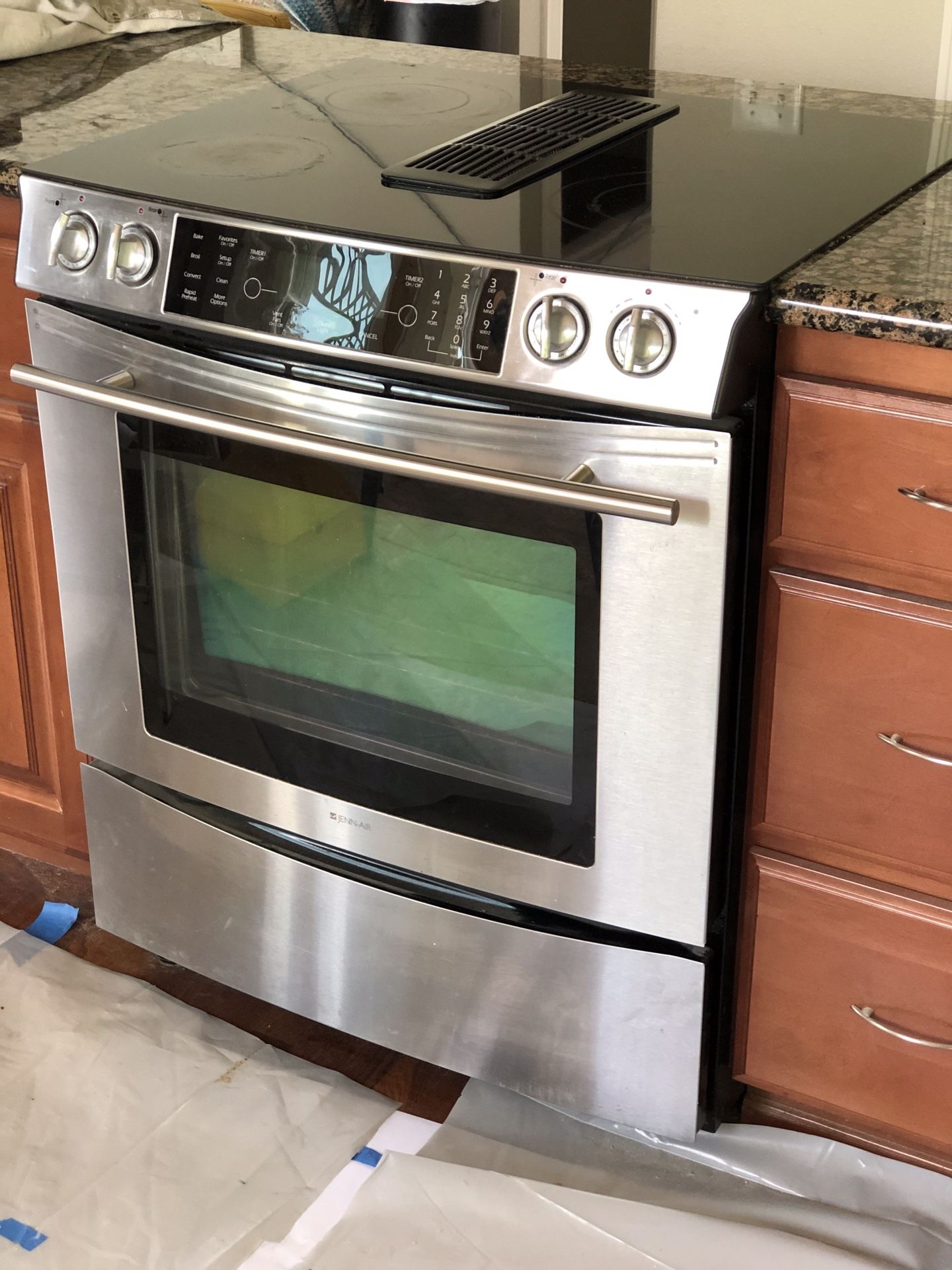 Electric Range 30” Jenn-Air induction with downdraft ventilation.