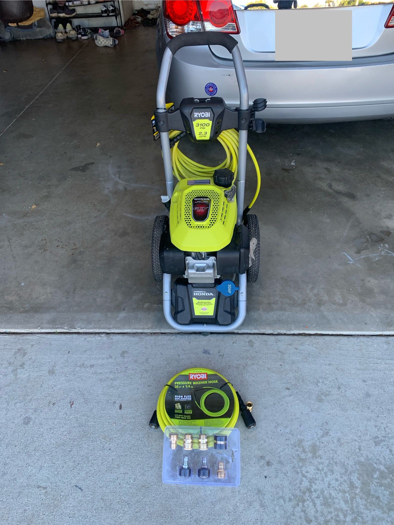 pressure washer w/ extra hose and attachments