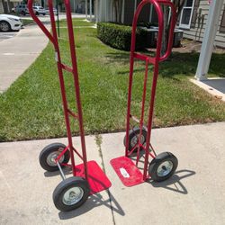  2 Red metal Hand trucks With Solid Rubber Tires