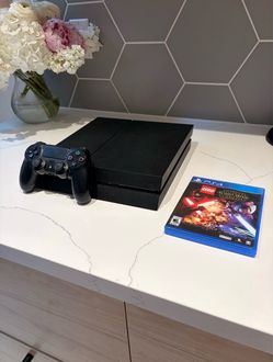 Sony PS4 Console with Controller and 2 Games
