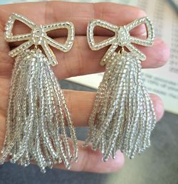 Silvery beaded bow tassel earrings