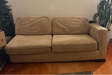 Tan L shaped sectional and ottoman