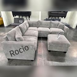 Gray corduroy sectional sofa with ottoman