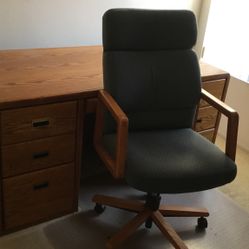 solid oak desk and cloth chair…. 
