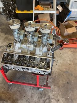 Chevy 327 std block with  Triple carbs and manifold  and std crank and Aluminum heads