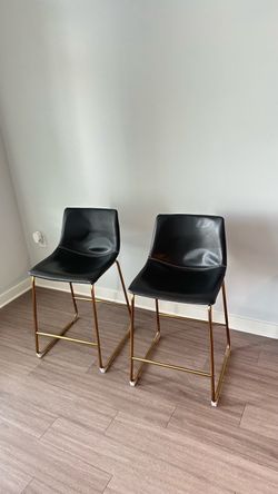 2 dark gray and gold  faux leather bar stools  - moving sale