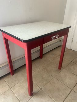 Enamel Table with Wooden Base 31 7/8” long x 21” depth x 30.75” tall