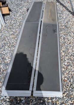 Metal ramp with skid protection wheelchair assistance