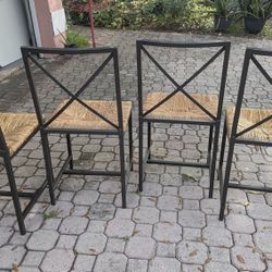 4 Metal And Straw Chairs! **