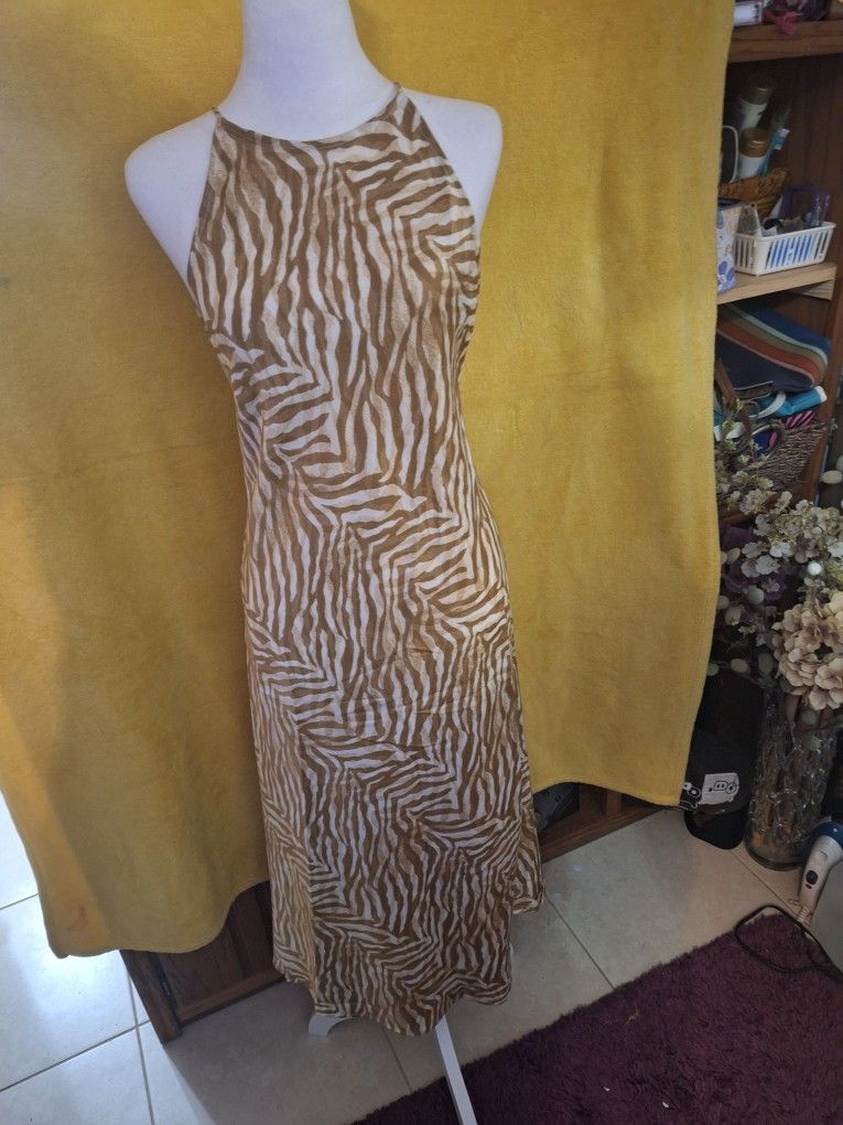 Banana Republic cross back slip dress size small. Excellent condition Brown and beige wavy stripes.. clean no damage. Worn once. Ready to go with flat