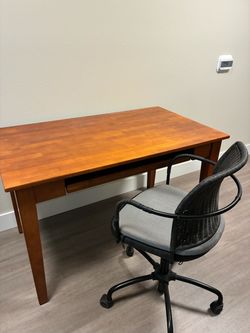 Wooden desk with pullout space