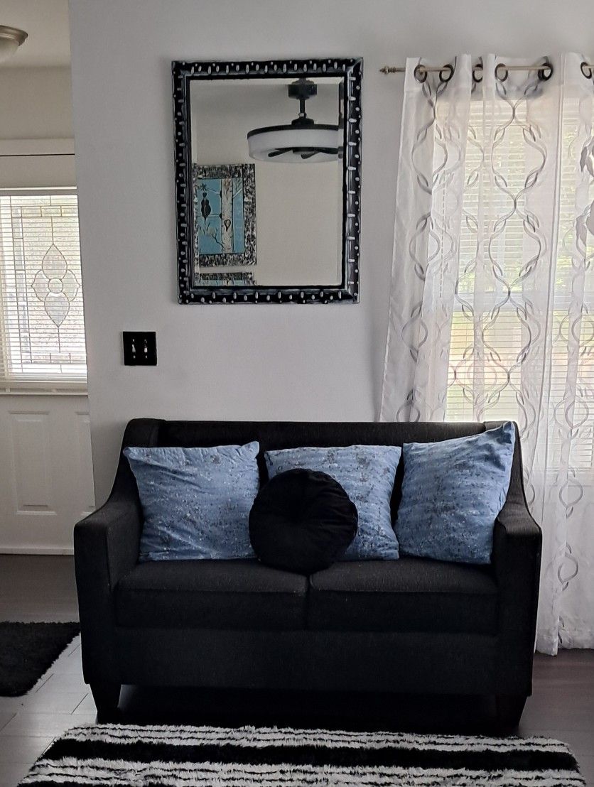 Sofa And Love Seat With Blue Pillows