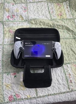 Very rarely used Playstation 5 Portal with  clear case and carry case - $200