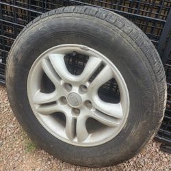 (1) Tire 235 60 R16 & KIA Rim 