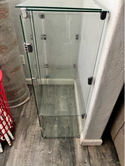 Glass display case with doors