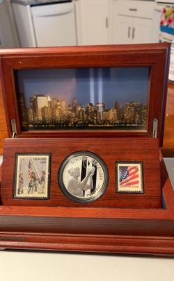 1 ounce silver coin with stamps and display box