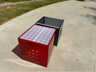 IKEA Lekman storage boxes feature a translucent, red acrylic design with decorative square cutouts