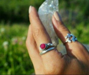 Sterling silver set ruby any size it's an adjustable ring