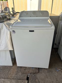 Washer brand Maytag heavy duty everything works great with a 3 months warranty