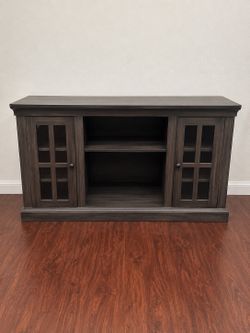 Dark wood TV stand