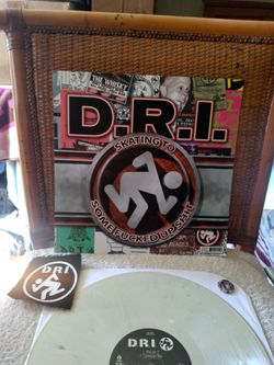 D.R.I. - Skating To Some Fu**cked Up Sh*it. On colored vinyl with a Patch and a Button. Near Mint. Limited Edition of 300 copies. #176. Punk Hardcore