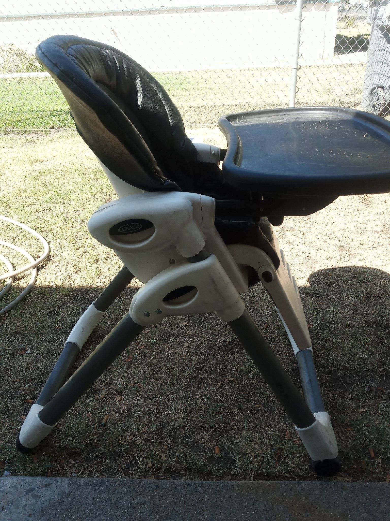 Graco portable black leather high chair