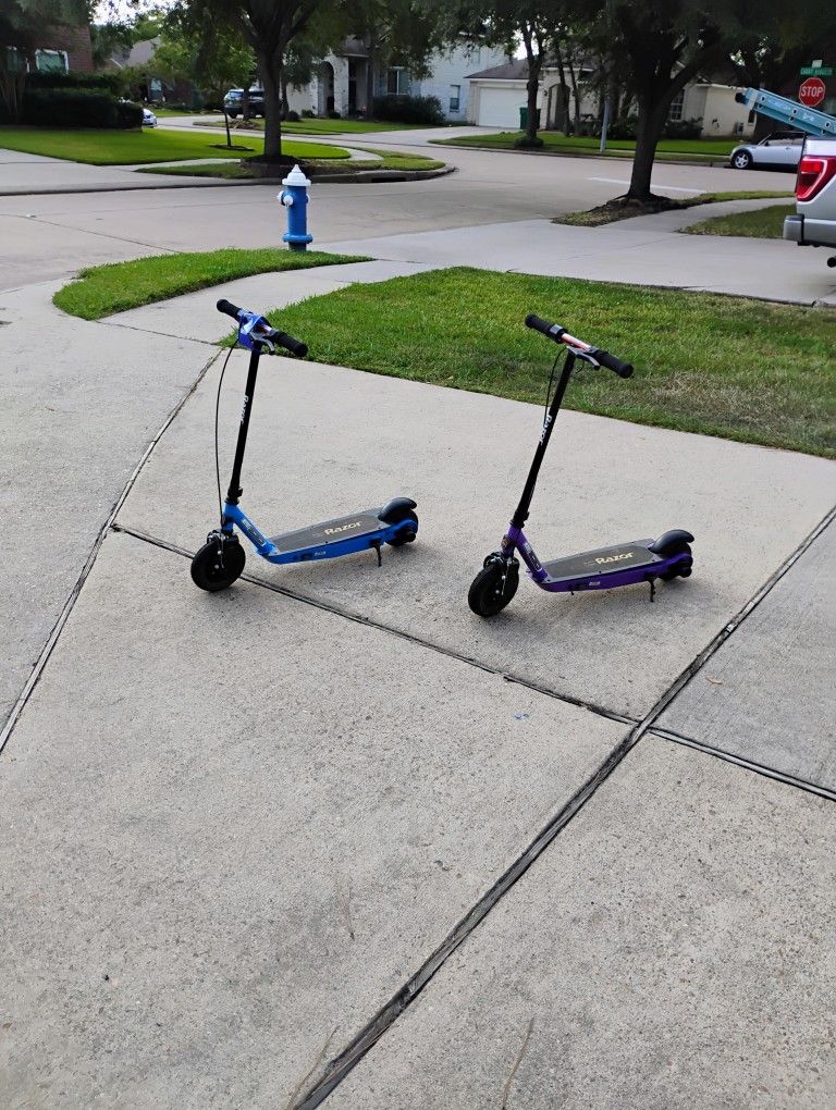 Scooters... Razor, E-100 Black Label,12 Volt..(Pair)..