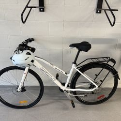 Two Costco Bikes, Two Helmets, Bike pump