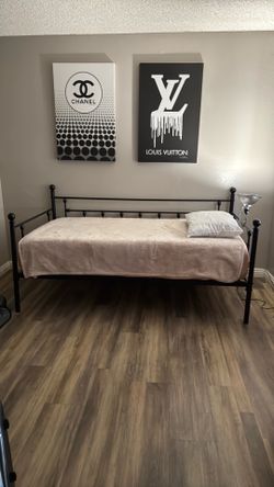 Black metal day bed