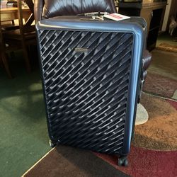 $120 Extra large lockable hard shell suitcase on wheels brand new never used plastic and tags still on it. Downsizing extras- got last year never used
