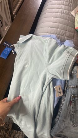 Two shirts medium and 2 Levi’s shorts size #32