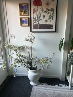 Large standing vase with floral branches