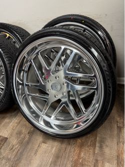 NEW staggered 24x9 and 24x11 esko wheels polished wrapped in Lexani tires