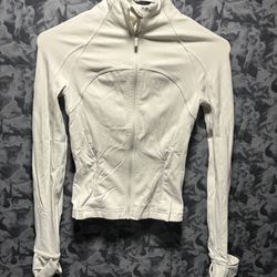Lululemon Cropped Define JacketOriginal Version size 2  The Lululemon Cropped Define Jacket in size 2 is a versatile activewear piece designed for wom