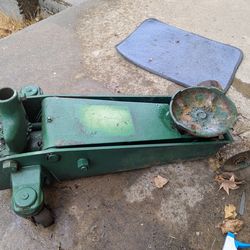 Heavy duty floor jack needs repair. Jack goes up but slowly comes down complete with handle