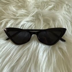 Black cat-eye sunglasses with a classic, stylish design, womens